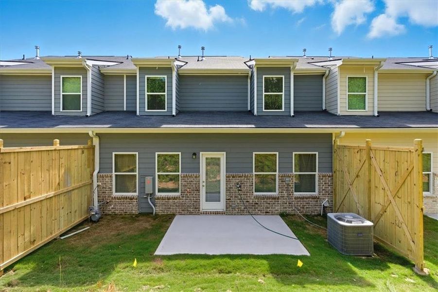 Exterior details and patio area of a home in Park Center Pointe, Austell (Image 3).