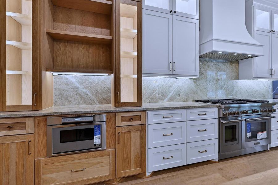 Warm wood accents balance sleek finishes for a timeless look.