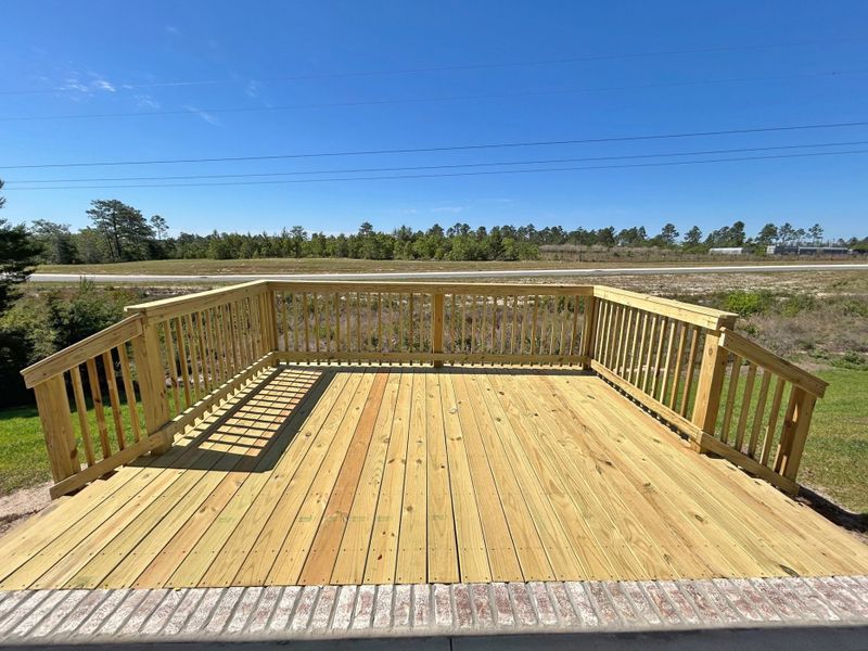 Exterior details and patio area of a home in The Bluffs at Lafayette, Freeport (Image 20).