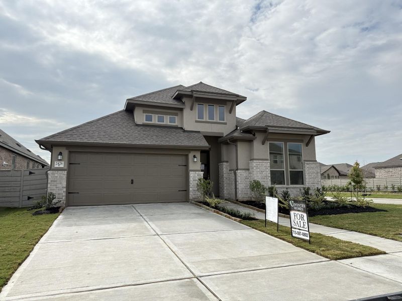 Front exterior of a new home in Pomona 50' & 55', Manvel, TX, highlighting curb appeal (Image 18).