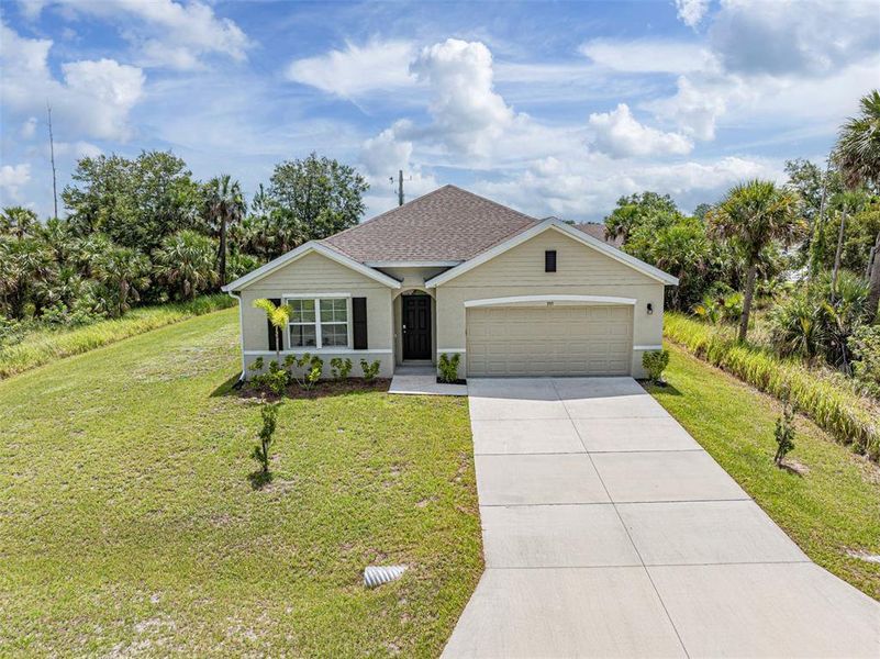 Front exterior of a new home in , Palm Bay, FL, highlighting curb appeal (Image 24). Front exterior of a new home in , Palm Bay, FL, highlighting curb appeal (Image 24).