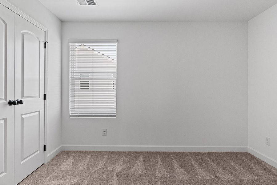 A room with a door and a window.