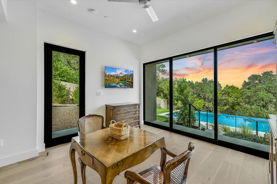 Dining area with light wood-style flooring, recessed lighting, and a ceiling fan