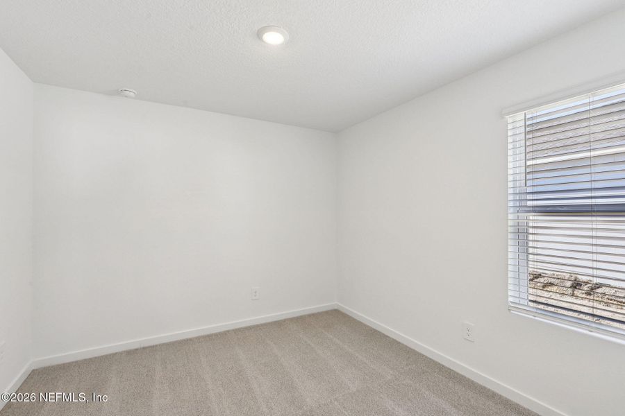 Spacious, unfurnished interior of a new home in Colbert Landings, Palm Coast (Image 38).