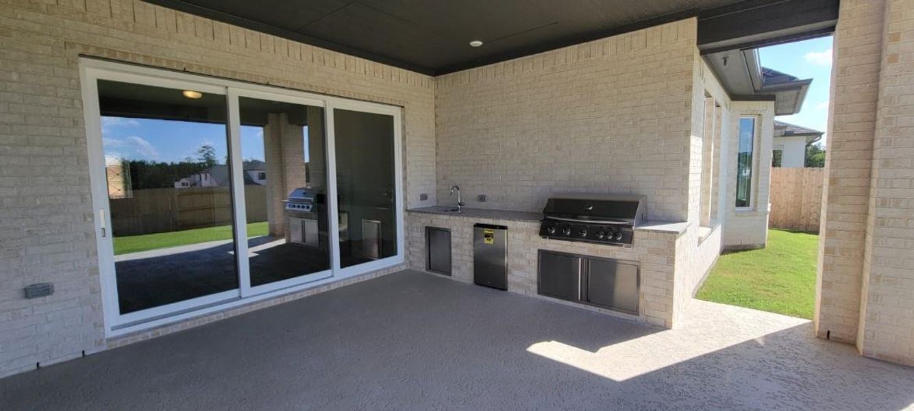 Exterior details and patio area of a home in WILDTREE 70', Montgomery (Image 7).
