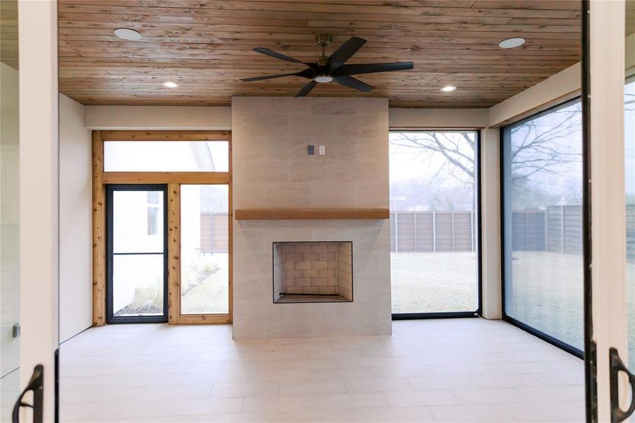 Outdoor living with gas fireplace and screens