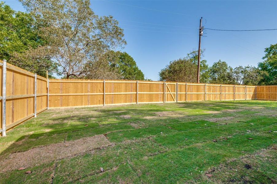 View of fenced backyard