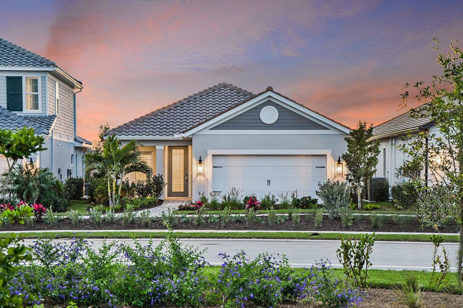 Representative exterior photo of a completed home built from the Dream 2 by Neal Communities in SkySail, Naples, FL (Image 21).