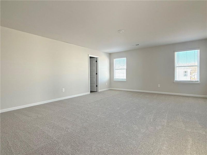 Spacious, unfurnished interior of a new home in Vines at Mill Creek - Estate Series, Braselton (Image 29).