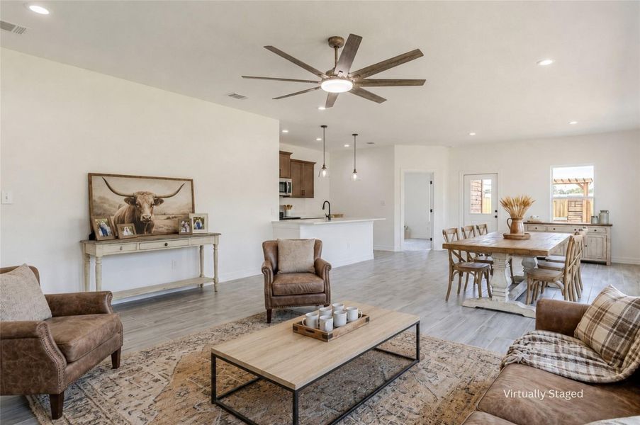 An open floorplan brings together the living, dining, and kitchen. An open floorplan brings together the living, dining, and kitchen.