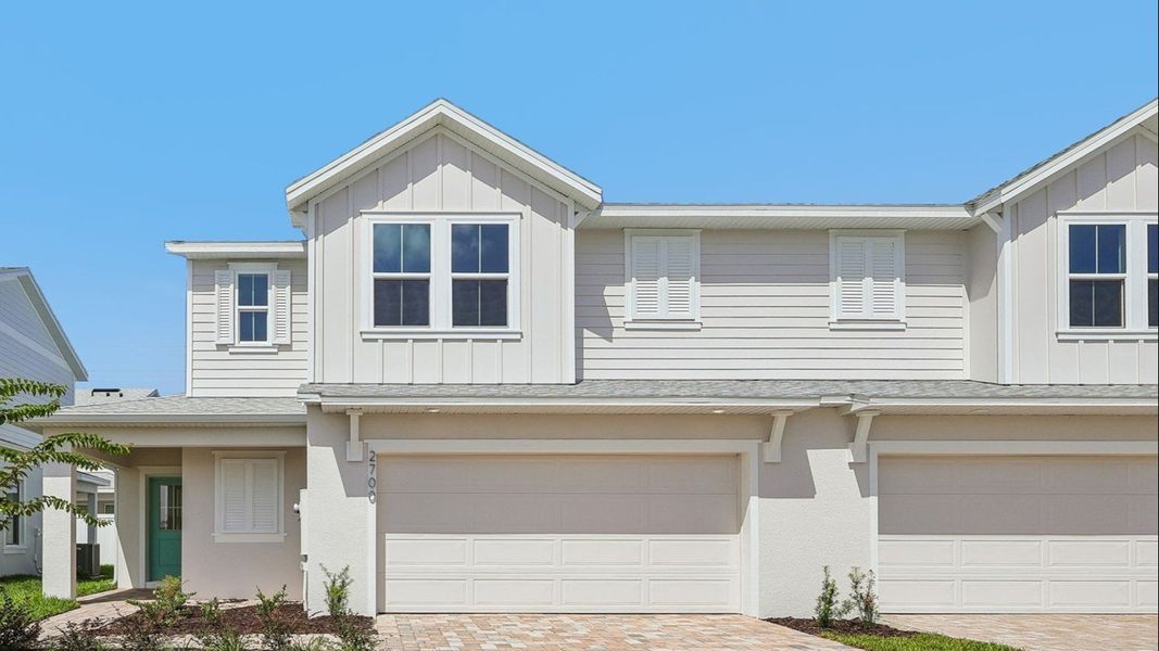 Front exterior of a new home in Cyrene at Harmony, St. Cloud, FL, highlighting curb appeal (Image 1). Front exterior of a new home in Cyrene at Harmony, St. Cloud, FL, highlighting curb appeal (Image 1).