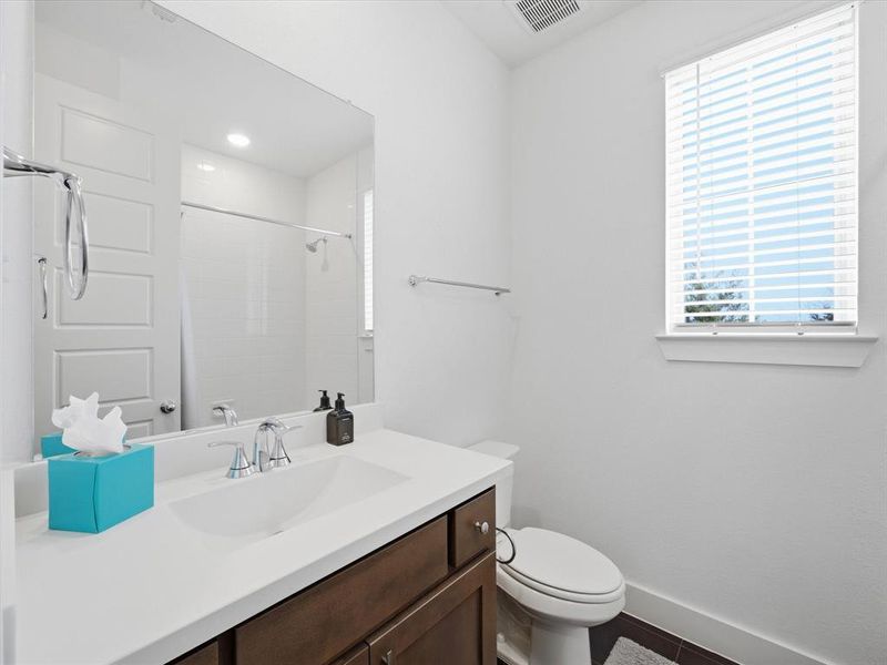 Full bath featuring vanity and a shower
