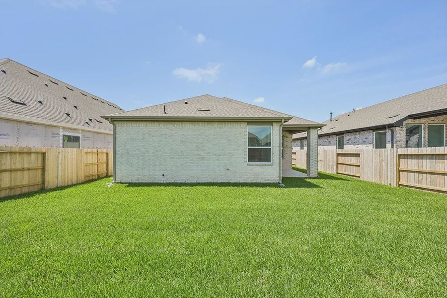 Exterior details and patio area of a home in Wood Leaf Reserve, Tomball (Image 21). Exterior details and patio area of a home in Wood Leaf Reserve, Tomball (Image 21).