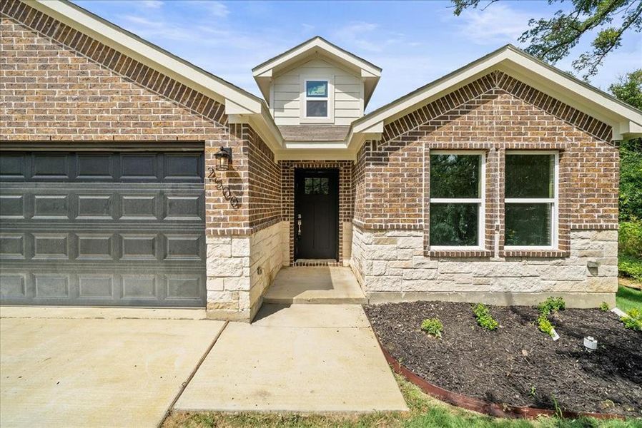 Front exterior of a new home in , Fort Worth, TX, highlighting curb appeal (Image 15). Front exterior of a new home in , Fort Worth, TX, highlighting curb appeal (Image 15).
