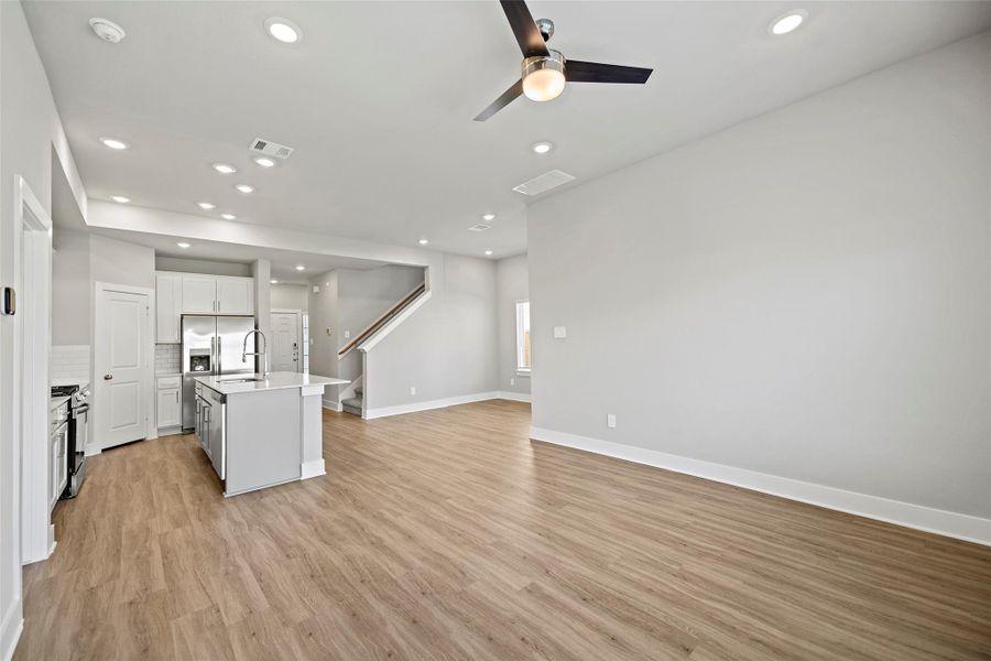 Spacious open-concept family room designed for gathering and relaxation.