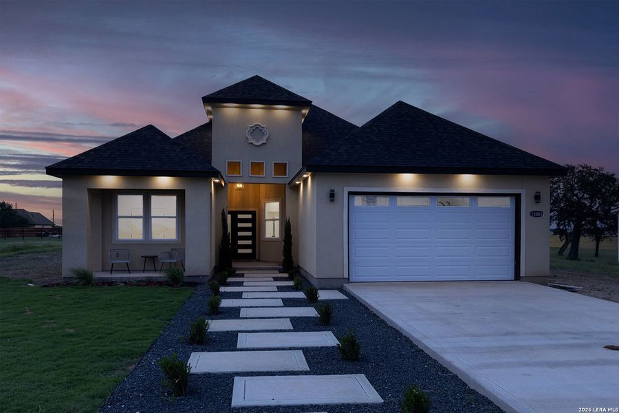 Front exterior of a new home in , Atascosa, TX, highlighting curb appeal (Image 30).