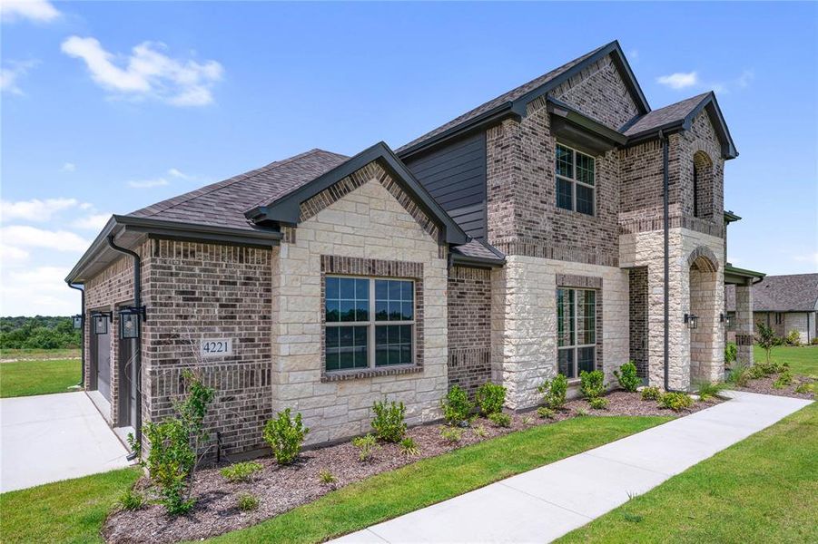 Front exterior of a new home in Eagle Ridge Estates, Weatherford, TX, highlighting curb appeal (Image 25). Front exterior of a new home in Eagle Ridge Estates, Weatherford, TX, highlighting curb appeal (Image 25).