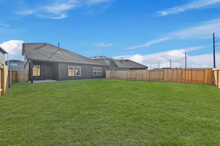 Exterior details and patio area of a home in Grand Pines, Magnolia (Image 11).