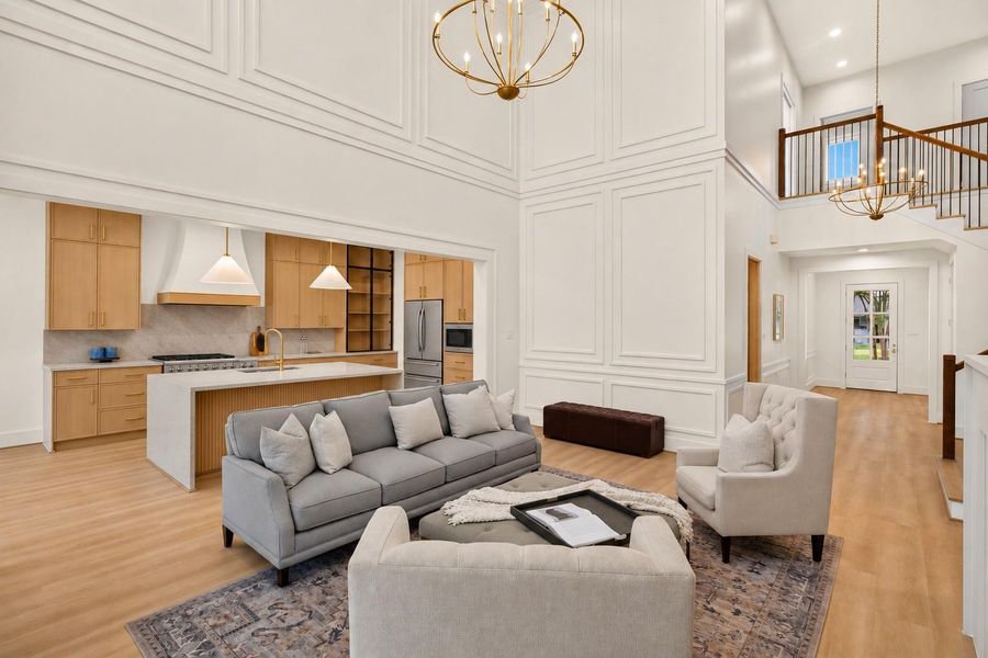 Designed for effortless entertaining, the open-concept layout seamlessly connects the living room, kitchen, and dining spaces while maintaining a bright and airy feel. Designed for effortless entertaining, the open-concept layout seamlessly connects the living room, kitchen, and dining spaces while maintaining a bright and airy feel.