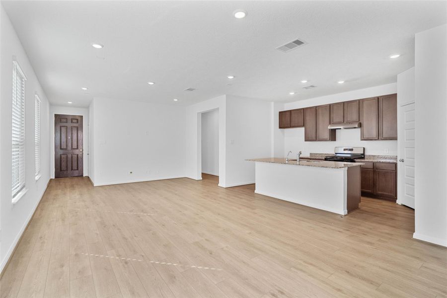 Stunning open-concept design seamlessly connecting the living, dining, and kitchen areas—perfect for both everyday living and entertaining! Stunning open-concept design seamlessly connecting the living, dining, and kitchen areas—perfect for both everyday living and entertaining!