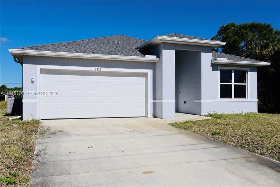 Front exterior of a new home in , Lehigh Acres, FL, highlighting curb appeal (Image 1). Front exterior of a new home in , Lehigh Acres, FL, highlighting curb appeal (Image 1).