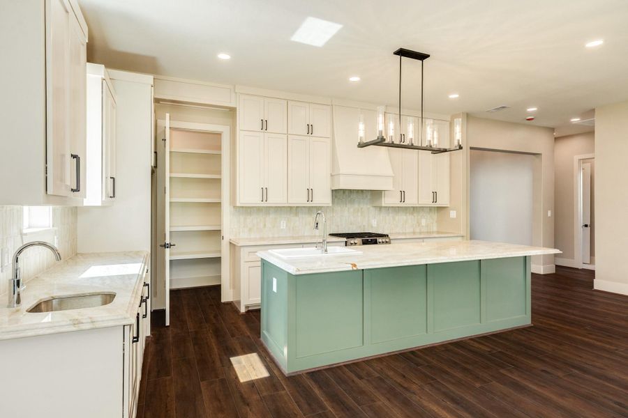 Ample cabinets for unlimited storage and a true walk in pantry for all of the over flow.  This kitchen was thoughtfully designed with the chef of the home in mind.