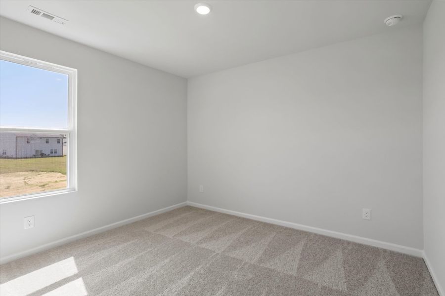 Spacious, unfurnished interior of a new home in Cambridge Reserve, Angier (Image 25).