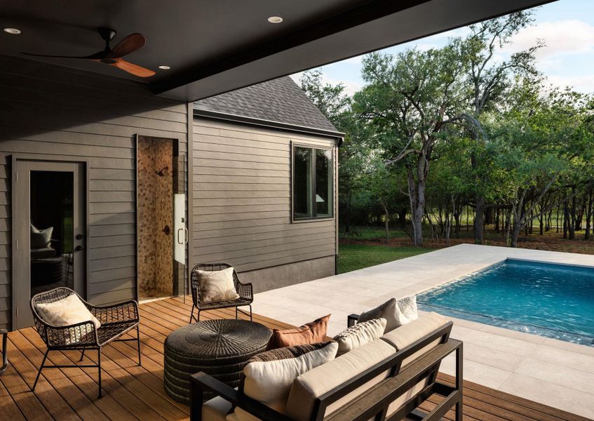 A spacious outdoor living area offers a refreshing pool and tranquil wooded views. A spacious outdoor living area offers a refreshing pool and tranquil wooded views.