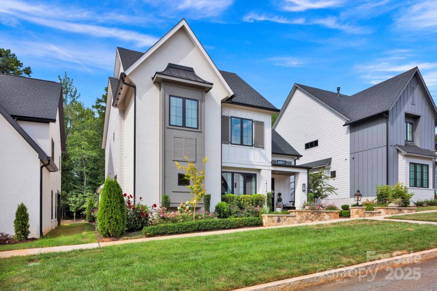 Front exterior of a new home in , Davidson, NC, highlighting curb appeal (Image 21).