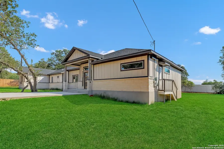 Front exterior of a new home in , Elmendorf, TX, highlighting curb appeal (Image 2).