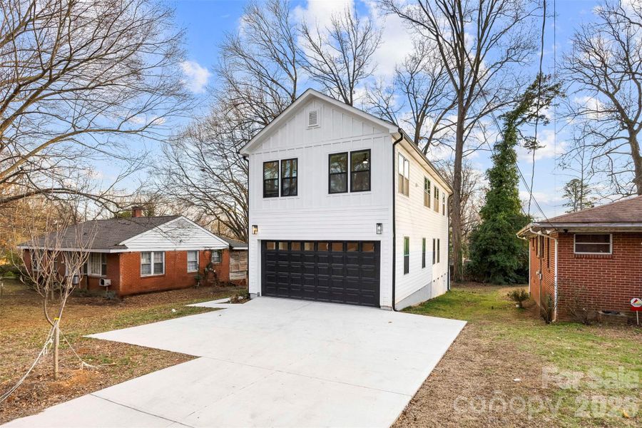 Front exterior of a new home in , Charlotte, NC, highlighting curb appeal (Image 24).