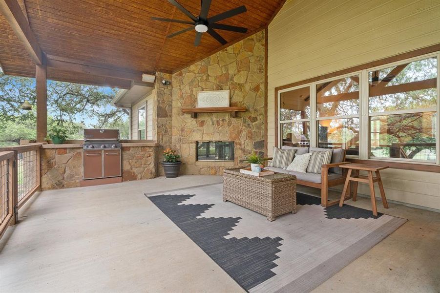 Home number two features a large covered patio with fireplace and built in grille over looking the beautiful wet weather pond