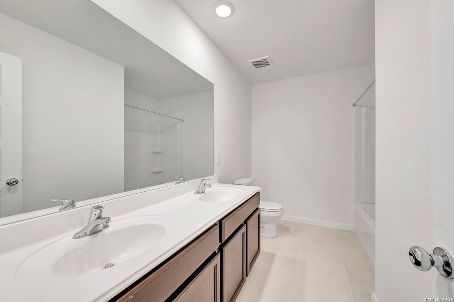 Furnished interior view inside a new home in Chaparral Ranch, Floresville (Image 16).