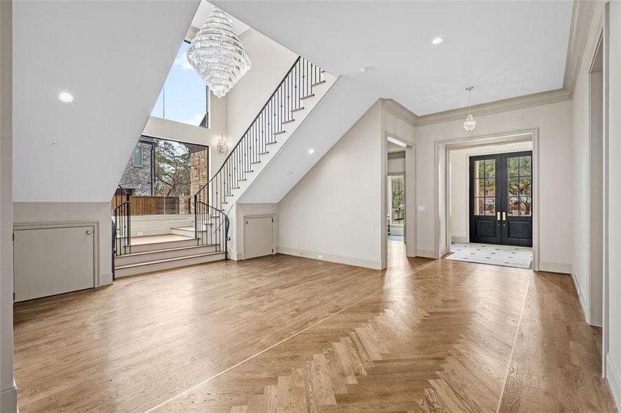 Inside this work-of-art home, ceilings dotted with recessed and designer lighting soar above rich hardwood floors, exceptional millwork and fresh paint in a neutral color palette.