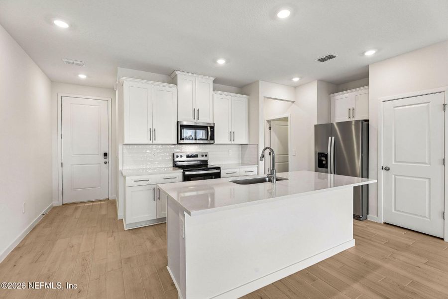 Furnished interior view inside a new home in The District at Oakleaf - The Grove, Middleburg (Image 10).