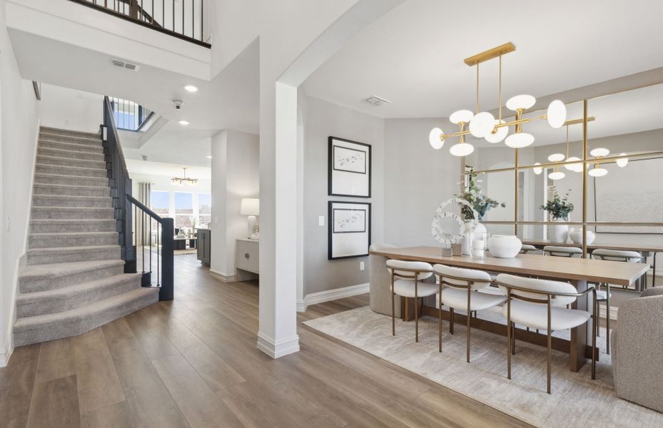 Welcoming entry into home with two-story ceilings