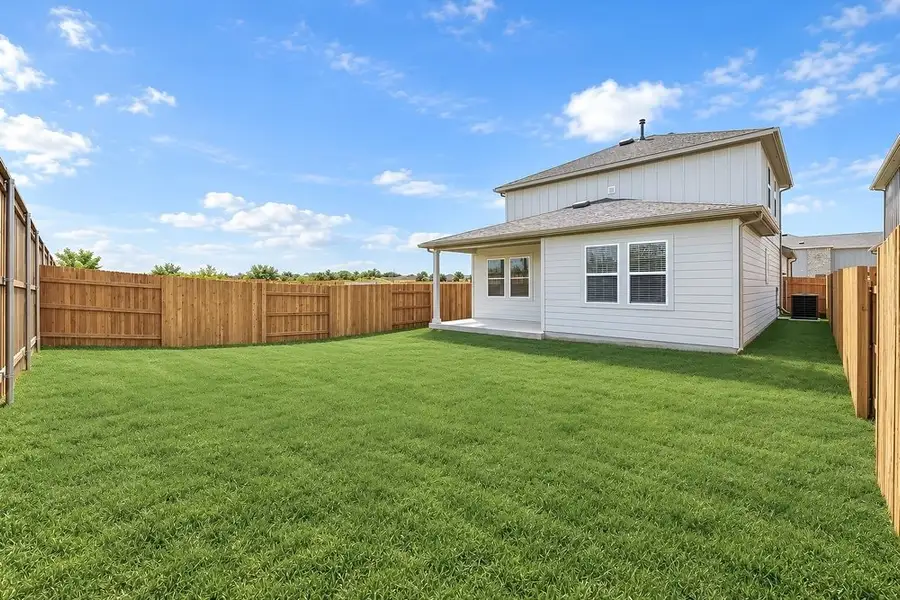 Exterior details and patio area of a home in Sunfield, Buda (Image 27).
