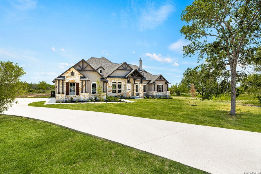 Front exterior of a new home in Legend Park, Castroville, TX, highlighting curb appeal (Image 16).