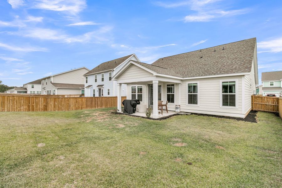 Exterior details and patio area of a home in High Point at Foxbank, Moncks Corner (Image 36).
