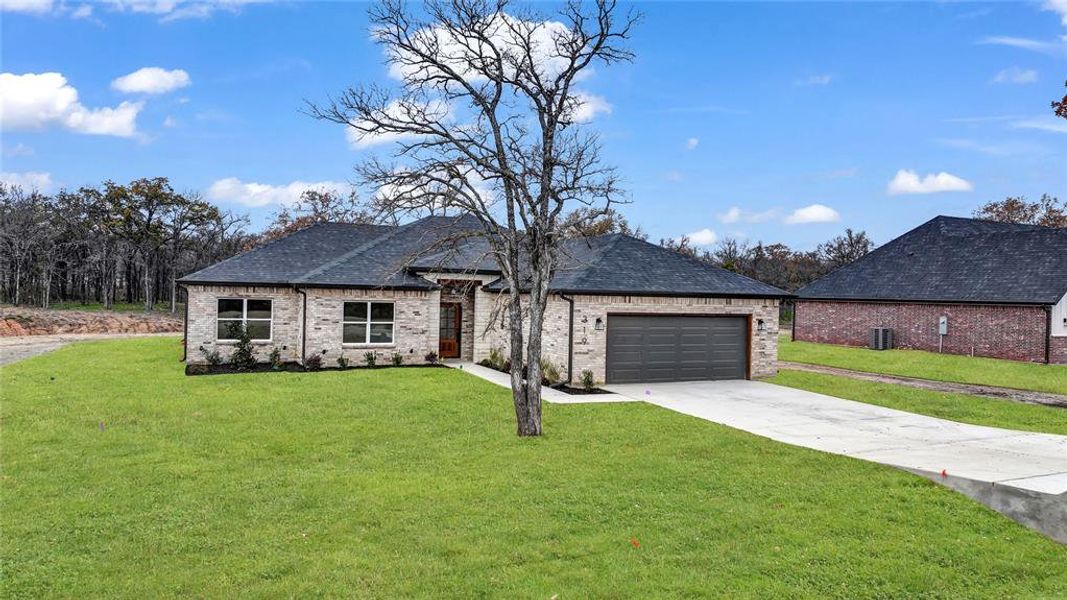 Front exterior of a new home in , Millsap, TX, highlighting curb appeal (Image 23).