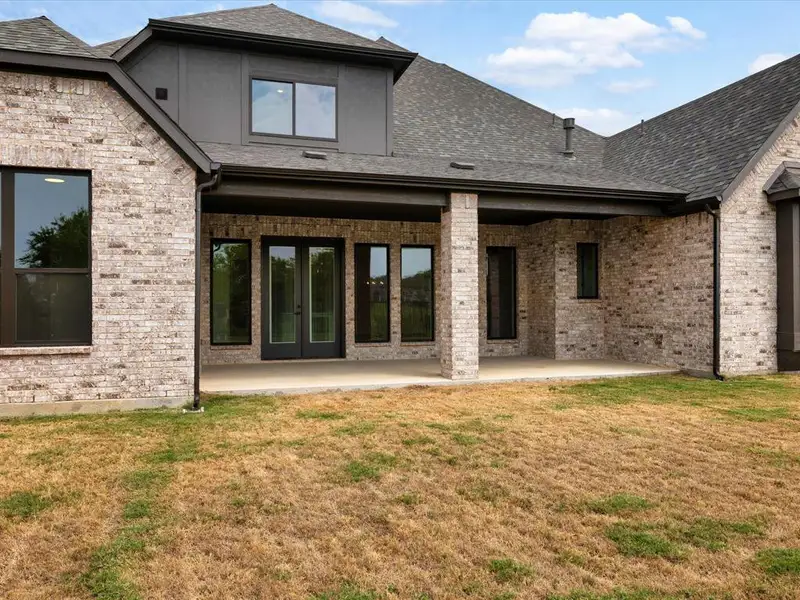 Exterior details and patio area of a home in Canyon Falls, Argyle (Image 4).