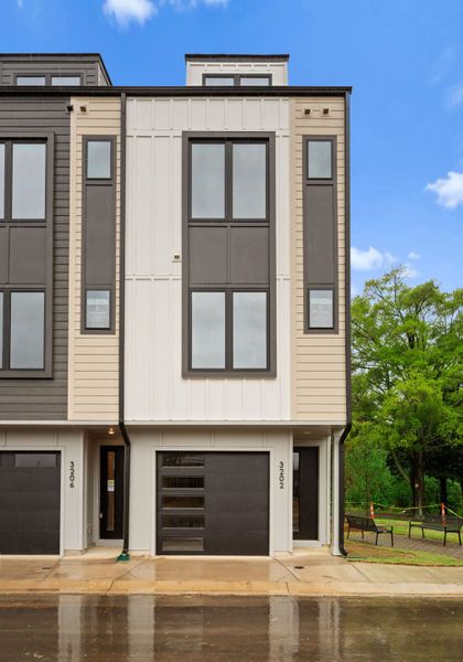Front exterior of a new home in Hartford Townhomes, Charlotte, NC, highlighting curb appeal (Image 10).