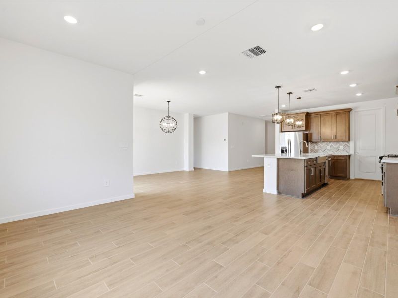 Spacious, unfurnished interior of a new home in Blossom Rock Reserve Series, Apache Junction (Image 13).