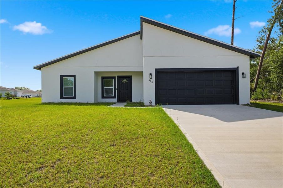 Front exterior of a new home in , Ocala, FL, highlighting curb appeal (Image 24).