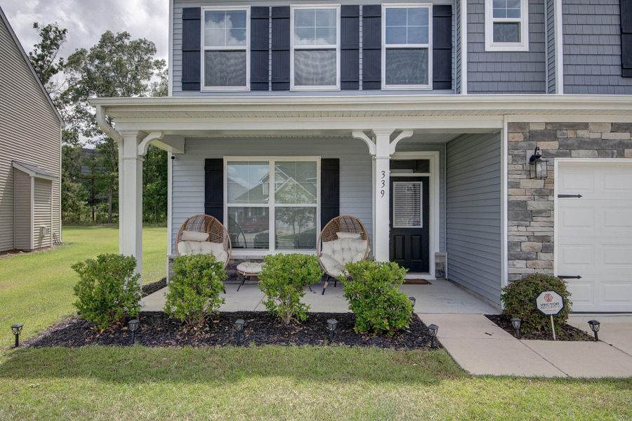 Exterior details and patio area of a home in Oakley Pointe, Moncks Corner (Image 4). Exterior details and patio area of a home in Oakley Pointe, Moncks Corner (Image 4).