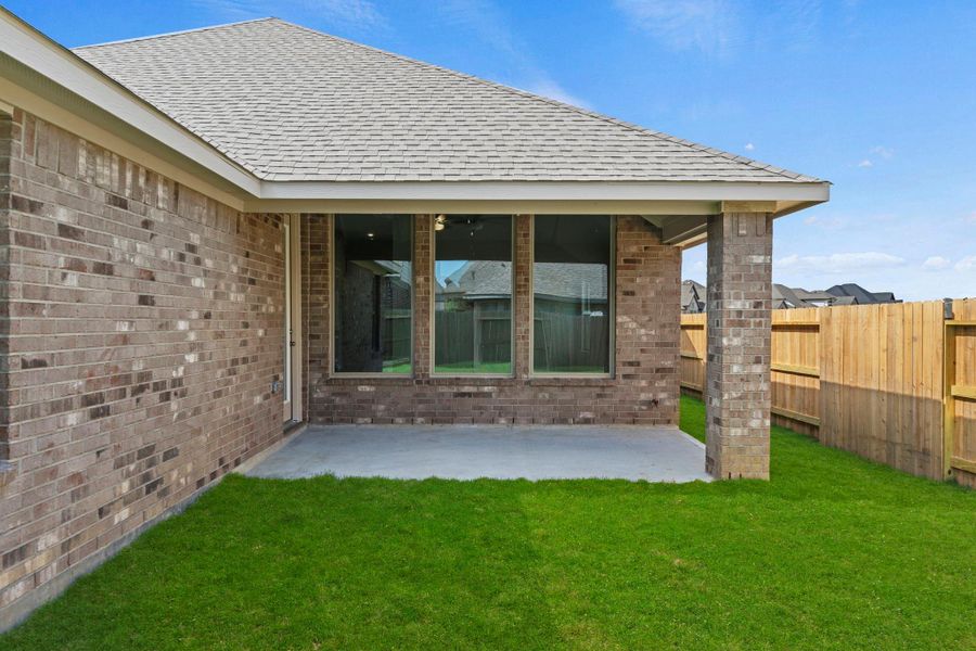Exterior details and patio area of a home in The Trails, New Caney (Image 4).