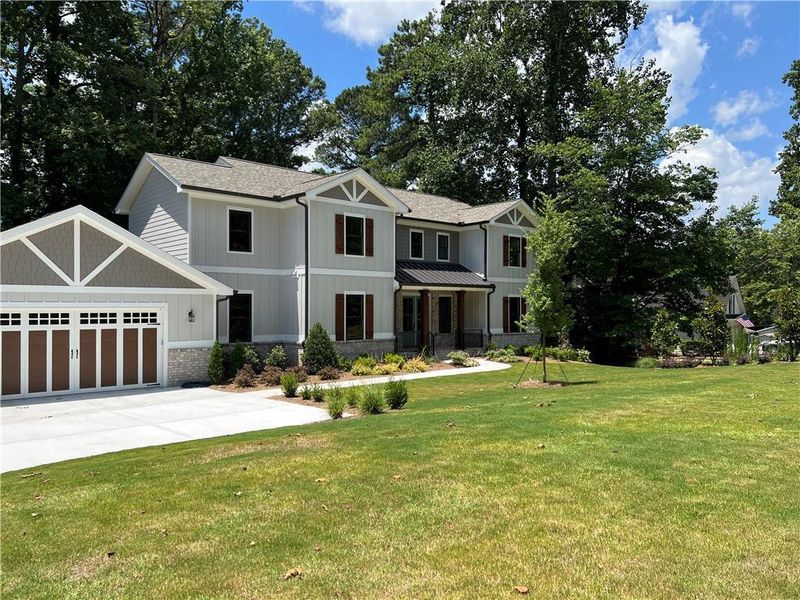 Front exterior of a new home in , Buford, GA, highlighting curb appeal (Image 31).