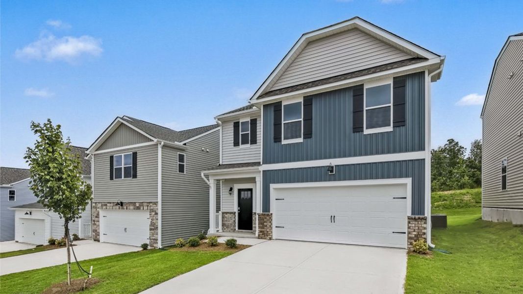 Representative exterior photo of a completed home built from the Robie by D.R. Horton in The Grove at Matthews Landing, Fuquay Varina, NC (Image 19).