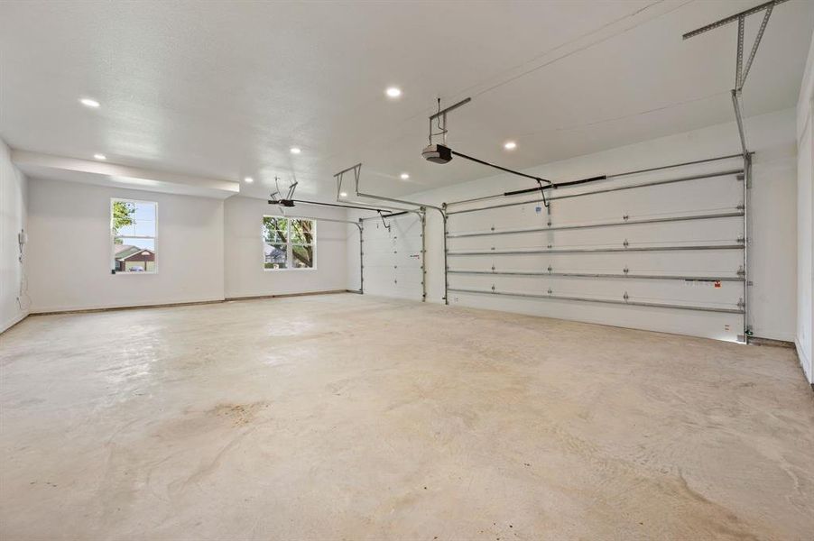 Garage with recessed lighting and baseboards Garage with recessed lighting and baseboards