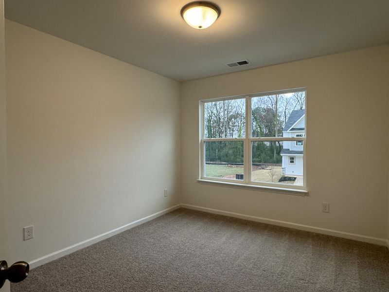 Spacious, unfurnished interior of a new home in East Main Townes, Spartanburg (Image 12).